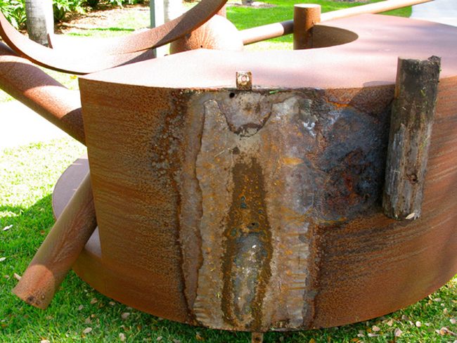Structural repair on a steel sculpture
